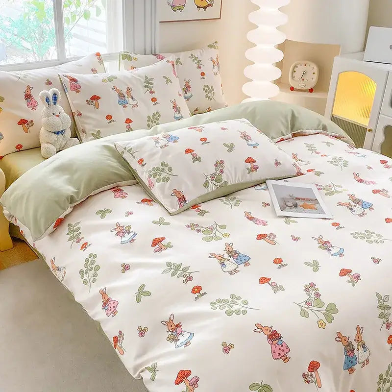 Cute printed cotton duvet cover in cream and navy featuring pastel bunny and mushroom patterns with soft green accents