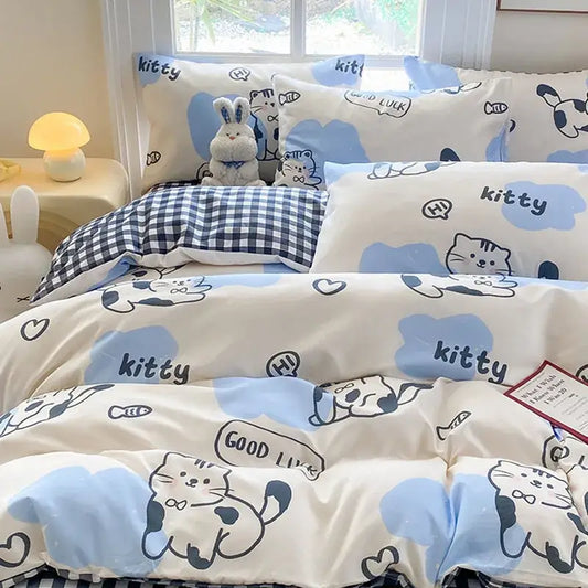 Cute printed cotton cream duvet cover with blue cartoon cat dog prints and navy gingham blanket for bedroom decorbites
