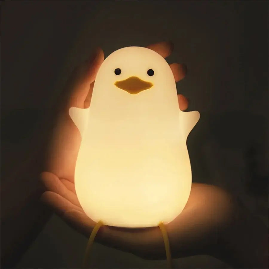 Soft glowing white penguin-shaped decorbites duck silicone night light with black eyes and yellow beak for bedroom dimming