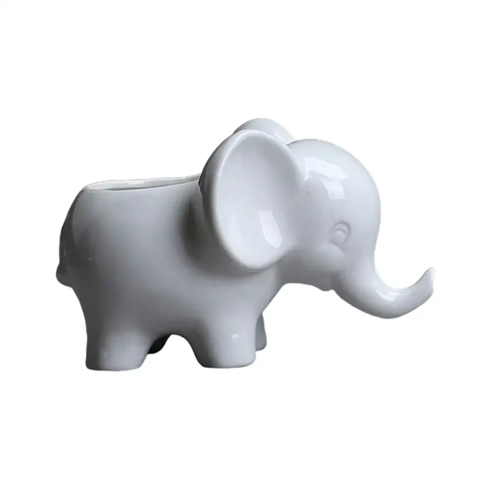 Cute white ceramic elephant succulent planter with a smooth glossy finish and hollow back for plants