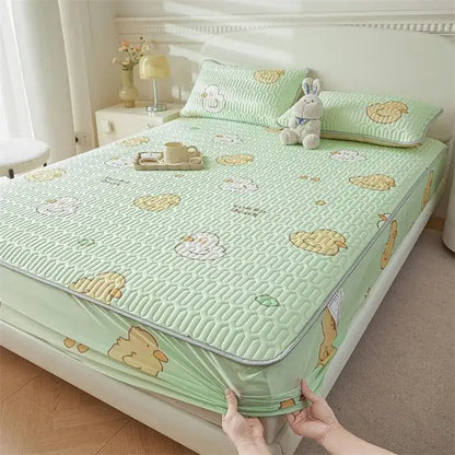 Light green quilted bed pad with cute cartoon pattern of yellow and white chicks for cooling fitted sheet use