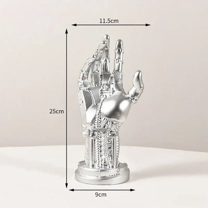 Silver metallic mechanical arm sculpture with intricate details on cylindrical base desktop stand decorbites cyberpunk decor
