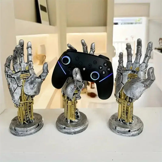 Silver and gold metallic mechanical arm desktop stand holding a black gaming controller with blue glowing accents decorbites cyberpunk mechanical