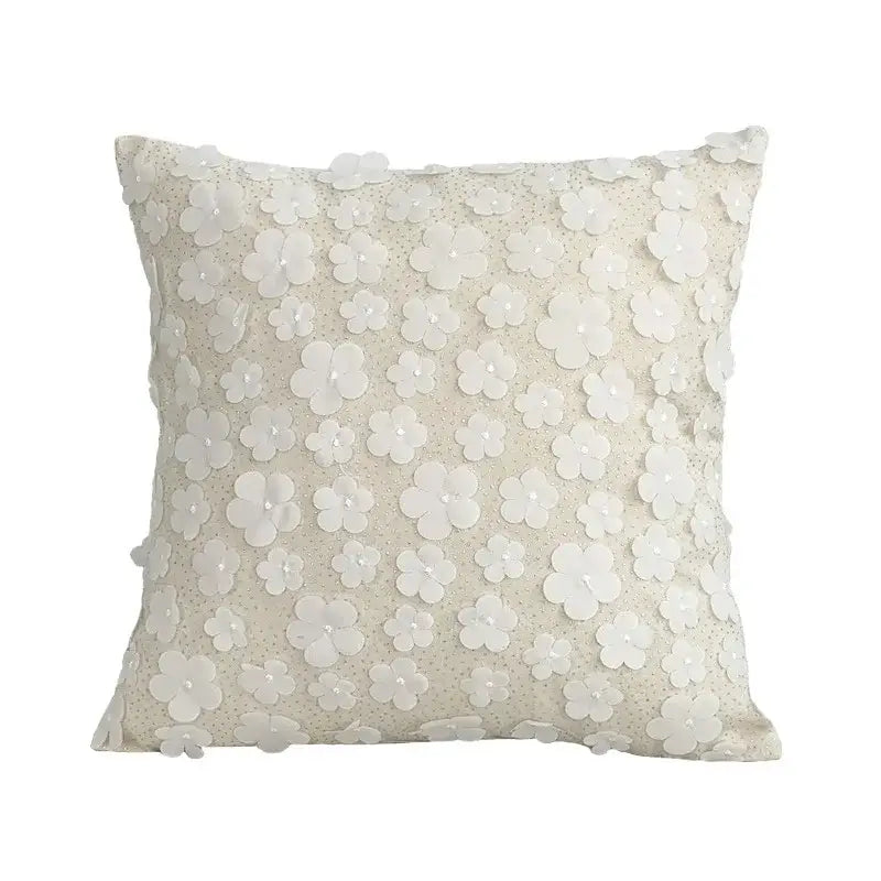 Off-white square cushion cover with delicate three-dimensional white floral appliqués daisy flora embroidered decorbites
