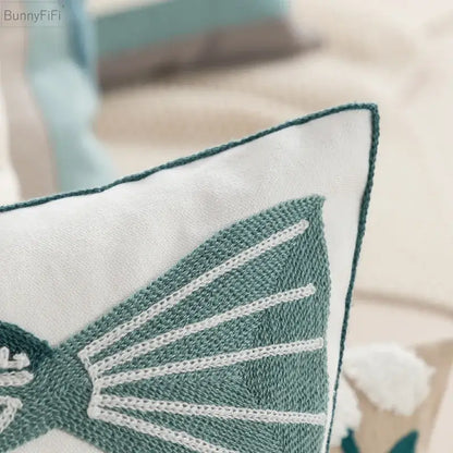 White cushion pillow cover with teal embroidered butterfly and contrasting stitching for decorbites daisy home decor