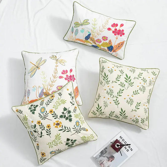Cream-colored cushion cover with daisy floral embroidery featuring vibrant dragonfly and floral designs for living room decorbites daisy floral pillow