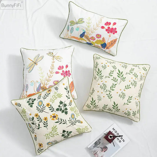 Bunnyfifi embroidered cushion cover with daisy floral green leaves and dragonfly motifs on cream fabric with olive green piping