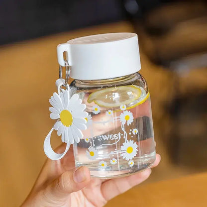 Clear glass daisy flower glass water bottle with white lid yellow daisies and decorbites daisy flower charm