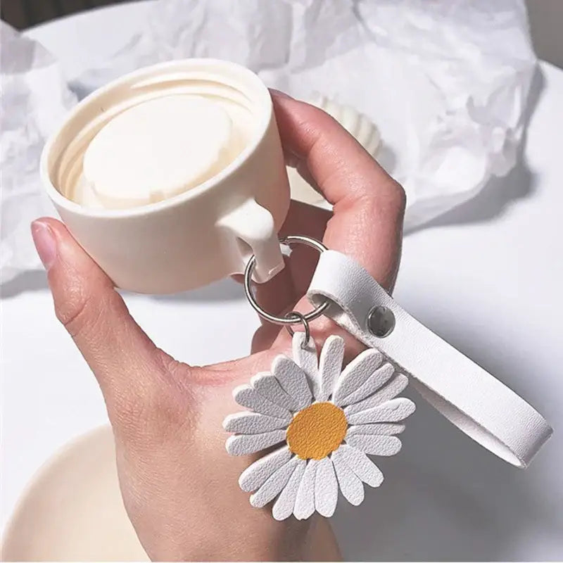White daisy flower glass water bottle keychain with yellow center and leather strap from decorbites daisy flower collection