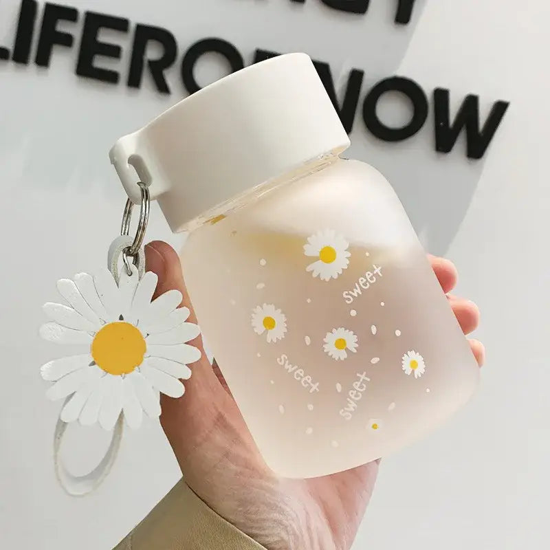 A frosted pink decorbites daisy flower glass water bottle with white lid and sweet print for kitchen tumbler charm