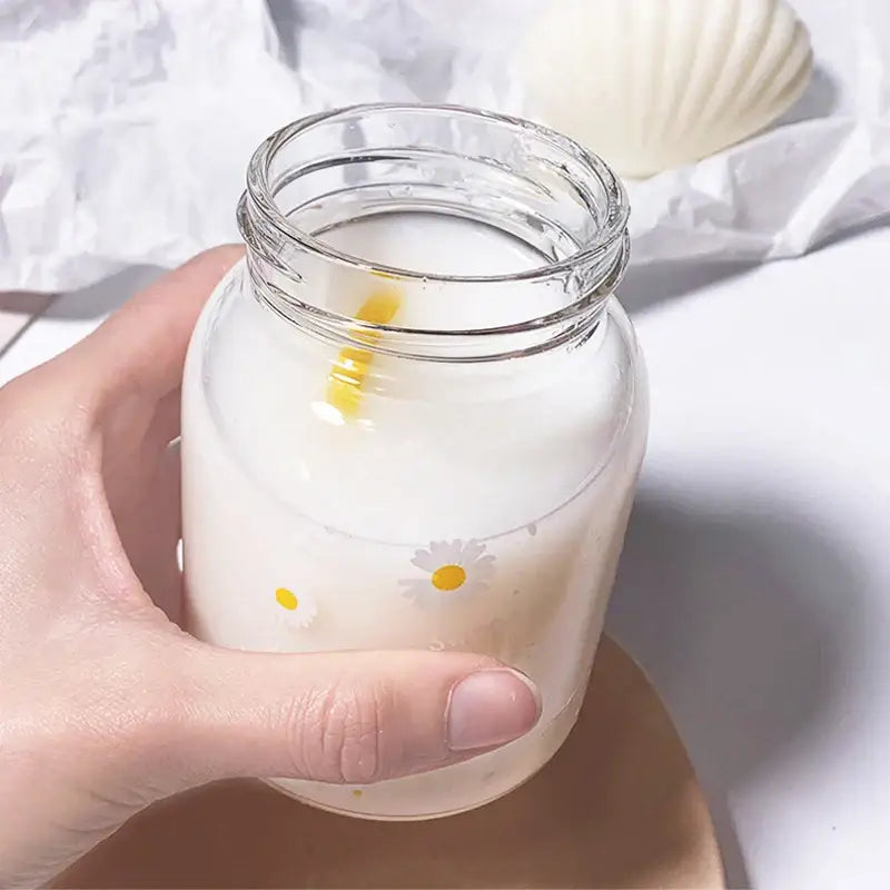 Clear glass daisy flower glass water bottle with handle decorated with decorbites daisy flower and yellow straw