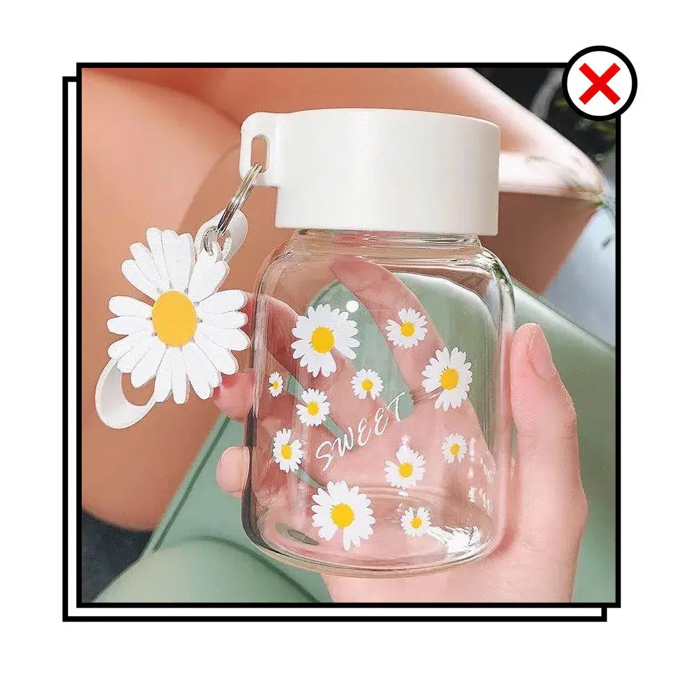 Clear glass daisy flower glass water bottle with white lid, daisy charm, yellow-centered decorbites daisy flower design