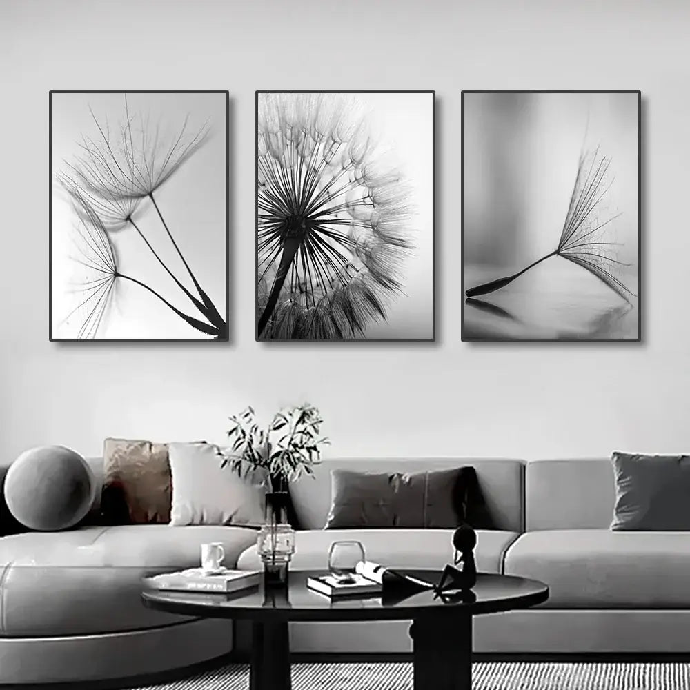 Three black-and-white framed dandelion flower pictures as white dandelion canvas wall art by DecorBites™