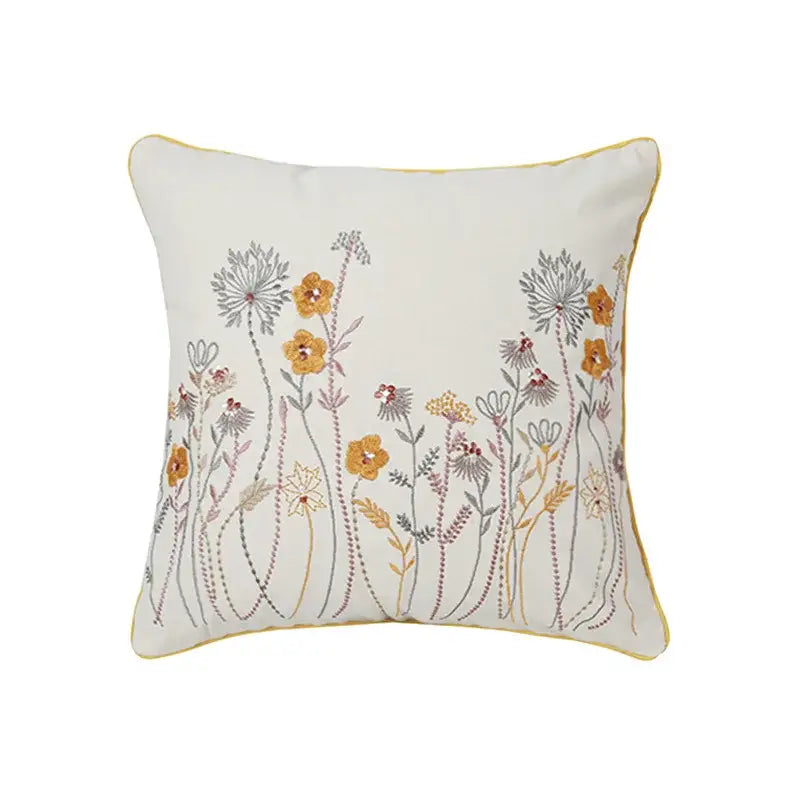 Cream-colored pillow cover with delicate dandelion floral embroidery in yellow and gray for living room decorbites decor