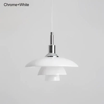 White layered glass pendant light with chrome accents Danish tiered frosted fixture as dining room focal point