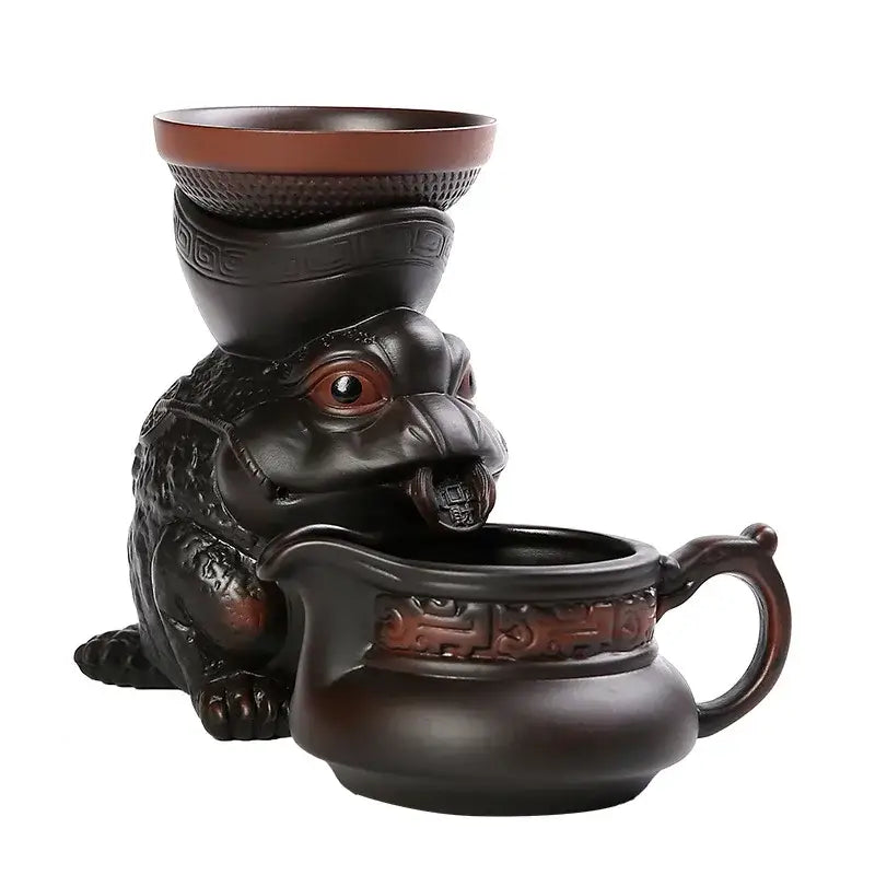 Dark brown ceramic funnel filter shaped like a seated toad with intricate carvings for decorbites dragon tea leaf use