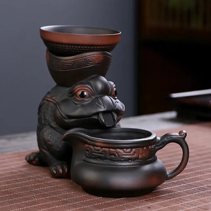 Dark brown ceramic funnel filter tea set featuring a detailed toad figurine with intricate dragon tea leaf decorbites patterns
