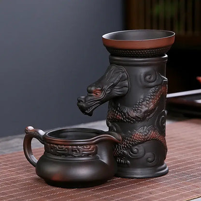 Dark brown ceramic dragon tea leaf funnel filter with red accents and matching pitcher for decorbites dragon tea decor