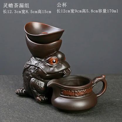 Dark brown ceramic dragon tea leaf funnel filter with sculpted toad and ornate pitcher for decorbites dragon tea decor