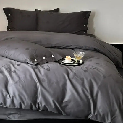 Dark gray egyptian cotton bedding set featuring satin-like fabric with floral embroidery and button detailing on pillowcases