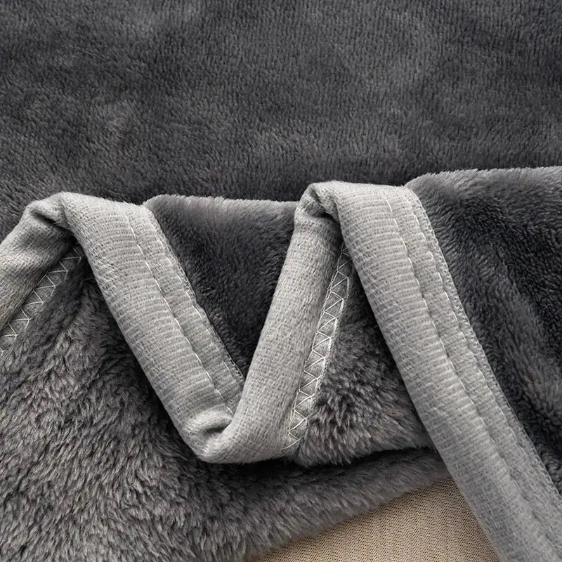 A dark gray and light gray decorbites cozy flannel blanket with soft textured fleece for living room sofa cover