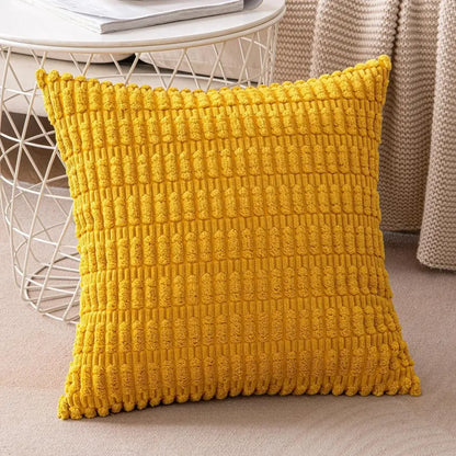 Vibrant yellow textured throw pillow with chunky knitted pattern paired with dark gray ribbed corduroy pillow cover decorbites cushion cover
