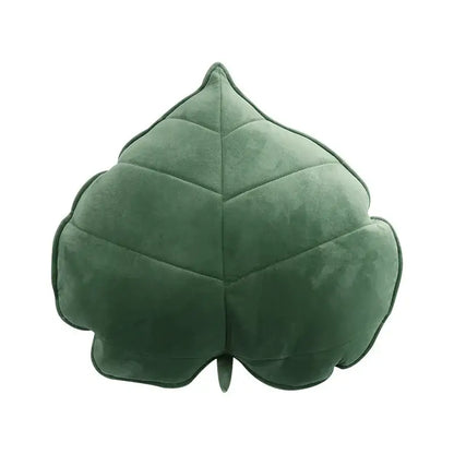 A dark green 3d leaf throw pillow with soft suede texture and stitched veins perfect for bedroom decorbites leaf throw
