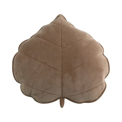 A taupe quilted plush leaf throw pillow with stitched veins from decorbites 3d leaf collection for bedroom decor