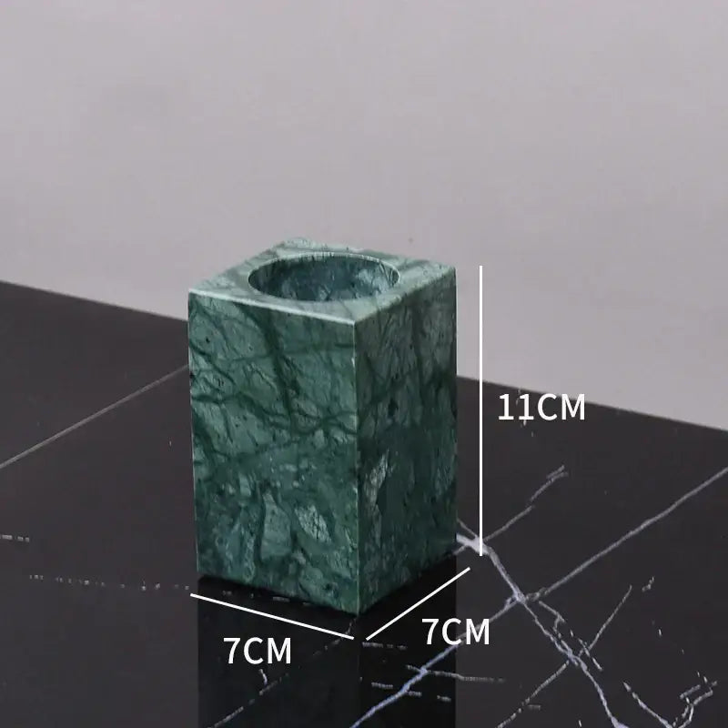 A square-shaped dark green marble candle holder with smooth polished surface and natural veining from decorbites dark green bathroom set