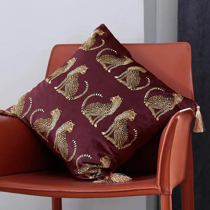Maroon velvet cushion cover with decorbites leopard cheetah print and matching tassels for living room decor