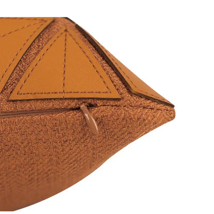Dark orange geometric leather pillow cover with woven texture and leather accents for decorbites bedroom decor