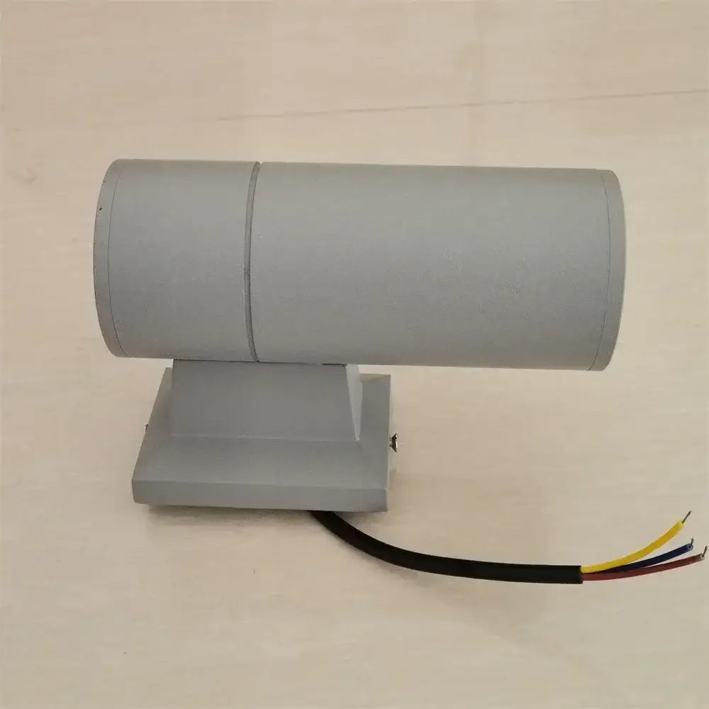 Modern black cylindrical 10w light wall outdoor porch spotlight with dual-section gray fixture and exposed wiring backside view