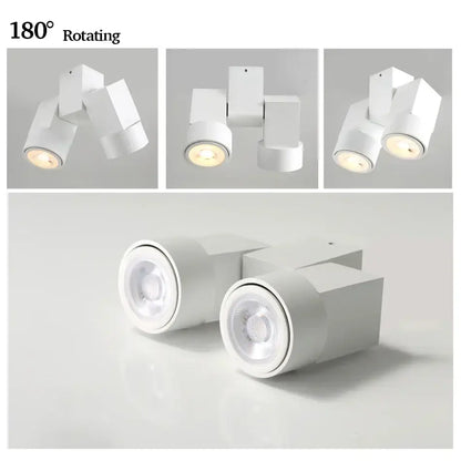 Modern white downlight surface mount with sleek geometric design and 180 degree rotating heads for living room use