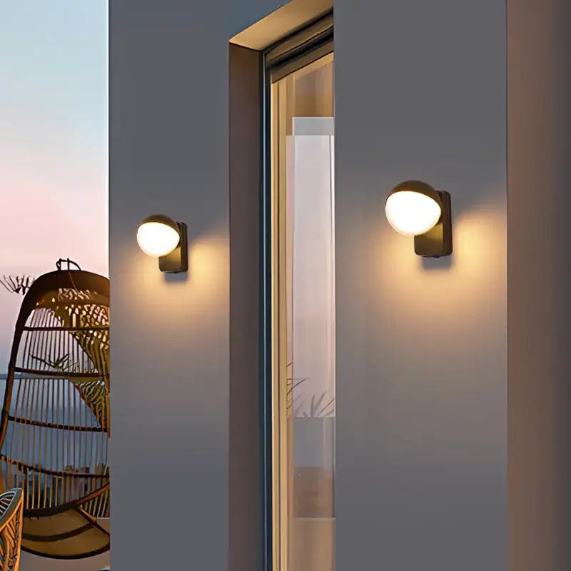 Modern matte black motion sensor wall lamps with warm circular frosted glass shades for porch waterproof lighting
