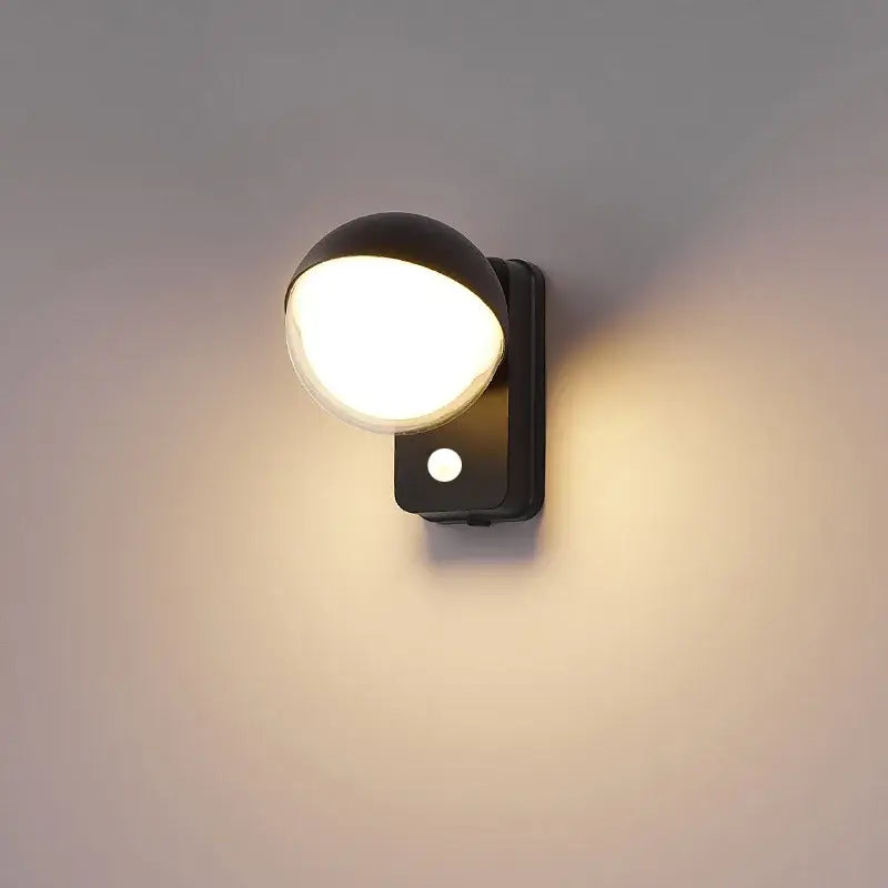 Modern black spherical led wall lamps with matte finish and motion sensor for porch lighting use