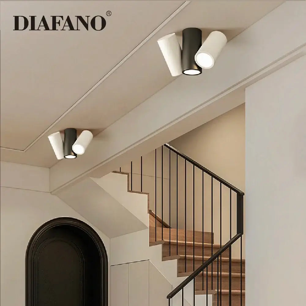 Modern black and white cylindrical dimmable ceiling spot light with sleek minimalist design for living room use