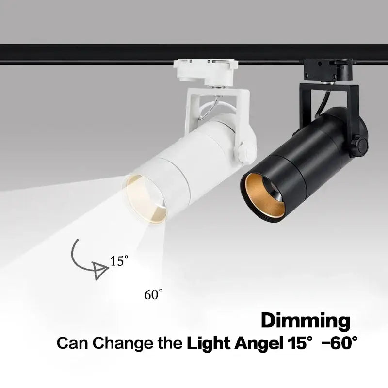 Two adjustable white and black track lights with gold interior mounted on a rail dimmable led spotlight 25w dimmable led