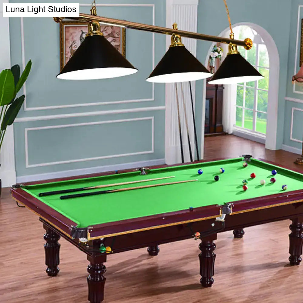 Dark wood pool table with green felt and decorbites 3-head conical metallic billiard light in black red blue