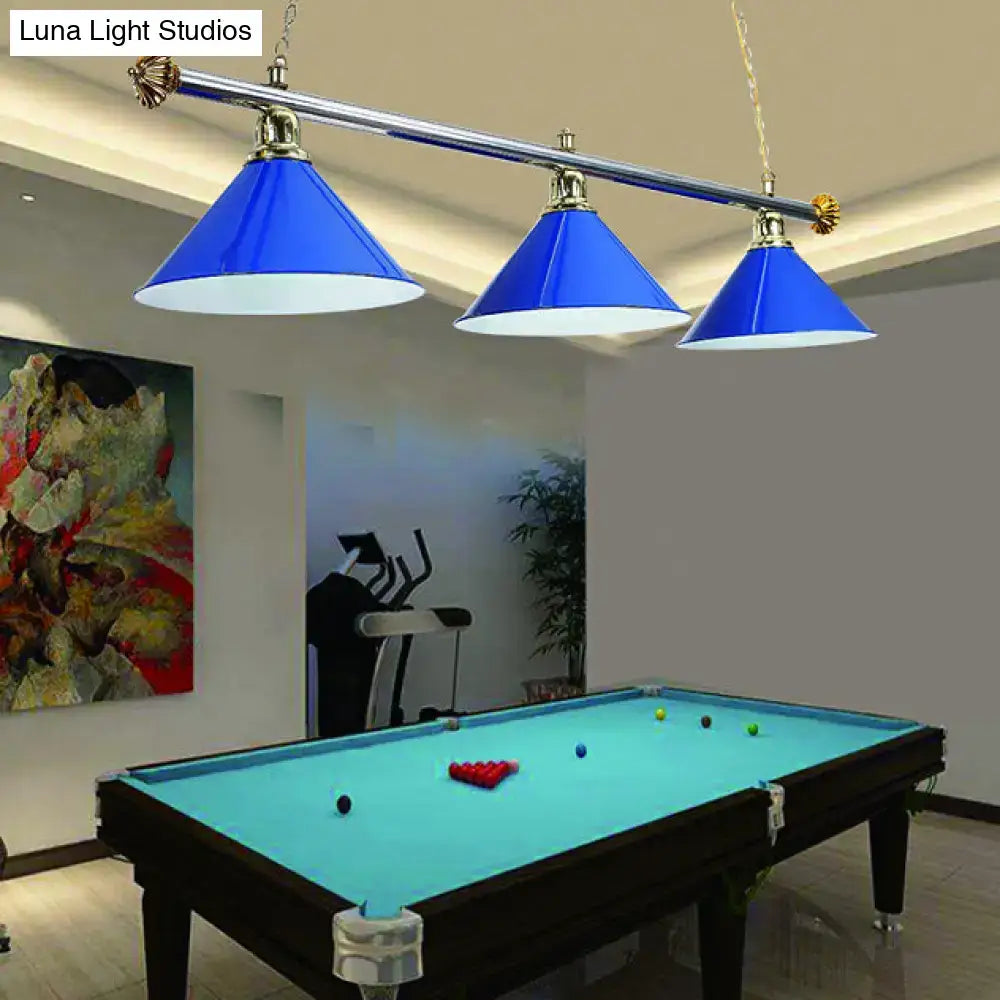 Blue conical metallic billiard light with brass accents hanging above a pool table in decorbites indoor lighting fixture