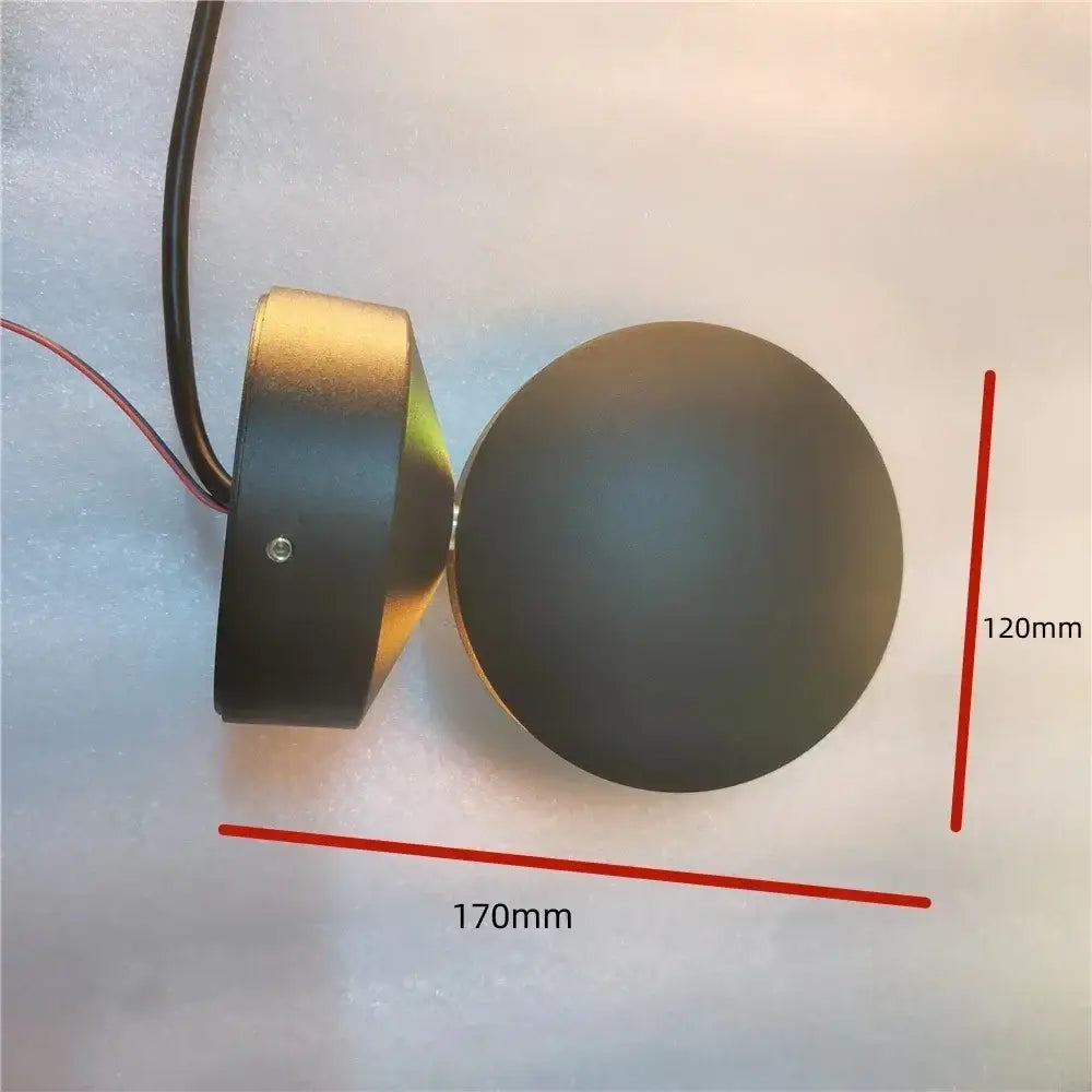 Black matte circular led wall lamp with cylindrical housing and wiring for modern white spherical window wall lighting