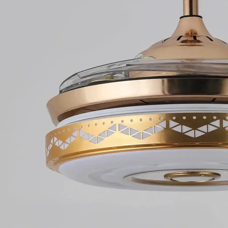 Modern gold bluetooth ceiling fan with integrated rgb color light and geometric cutout patterns for bedroom use