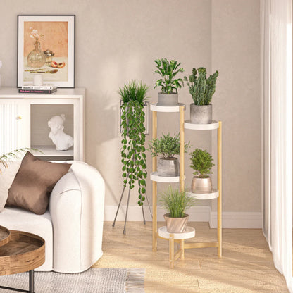 Modern bamboo plant stand with five white circular shelves and slender legs holding green plants in concrete pots