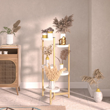A minimalist four-tiered plant stand with gold metal legs and white shelves holding dried plants, not bamboo plant stand
