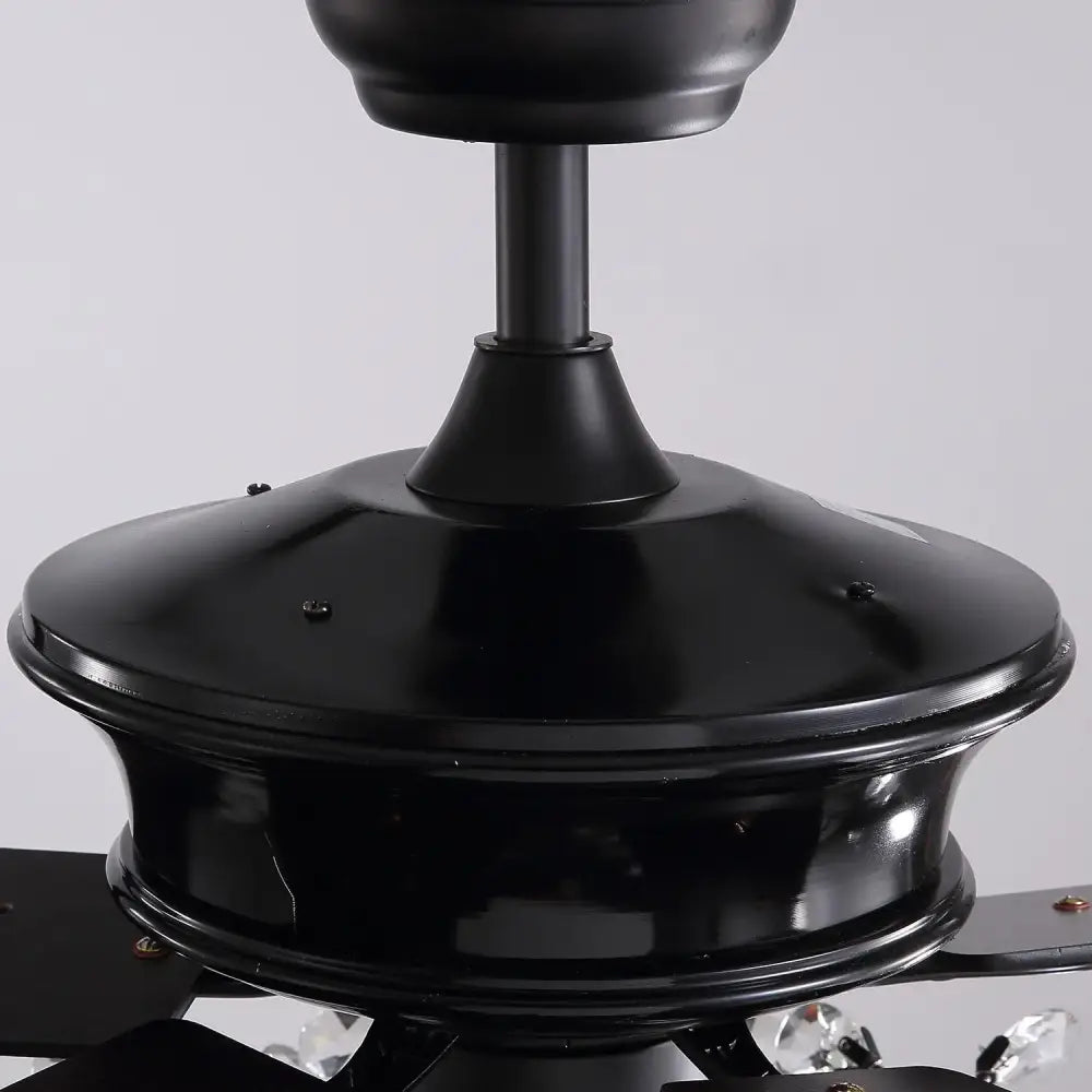 Luxury black crystal ceiling fan with glossy finish, crystal accents, and wood blades for living room use with remote