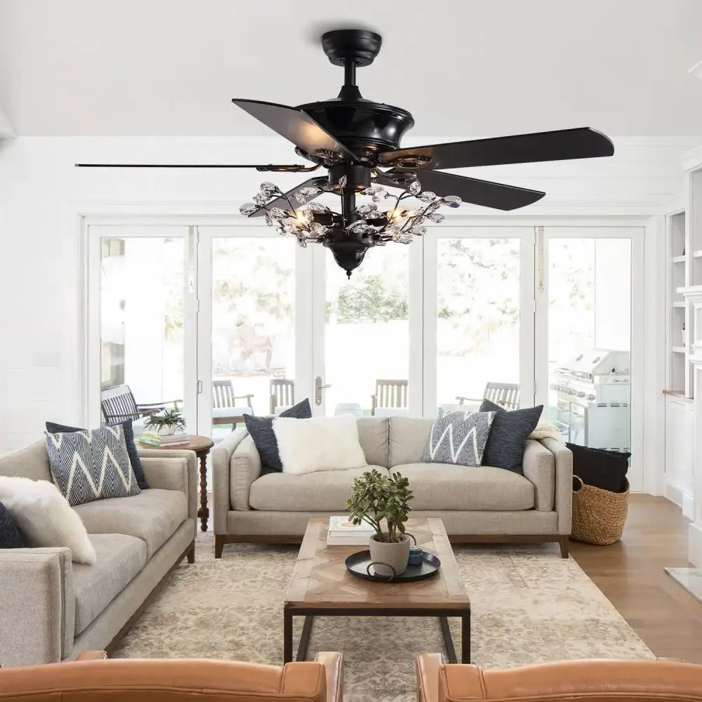 Luxury black crystal ceiling fan with wood blades and chandelier accents designed for living room use with remote control