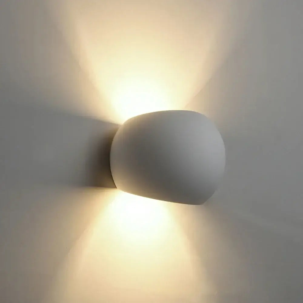 Decorbites™ 5w led gypsum wall lamp in matte white ceramic with rounded design emitting warm ambient light