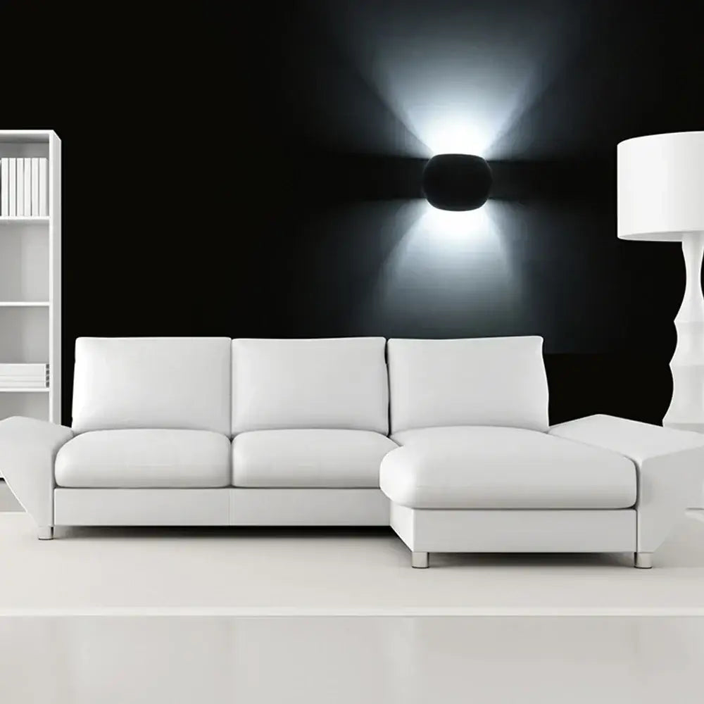 White leather sectional sofa with clean lines complements decorbites™ led gypsum wall lamp for modern living spaces