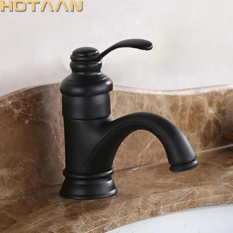 DecorBites matte black basin faucet with single handle curved spout and ornate base for antique brass basin fixtures