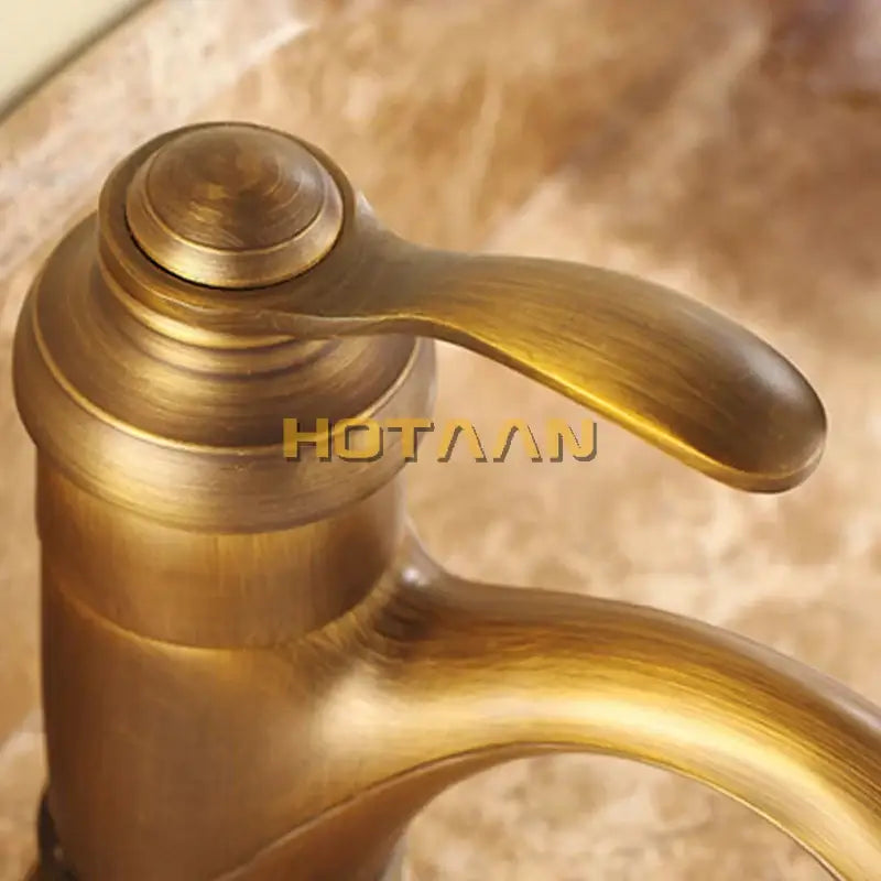 Decorbites 6 inch antique brass basin faucet with single handle curved spout and ornate design YT-5065