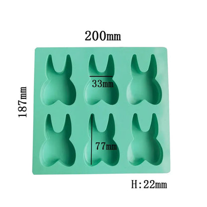 A mint green silicone mold with six bunny-shaped cavities from decorbites™ 6 hole tooth silicone mold bakeware